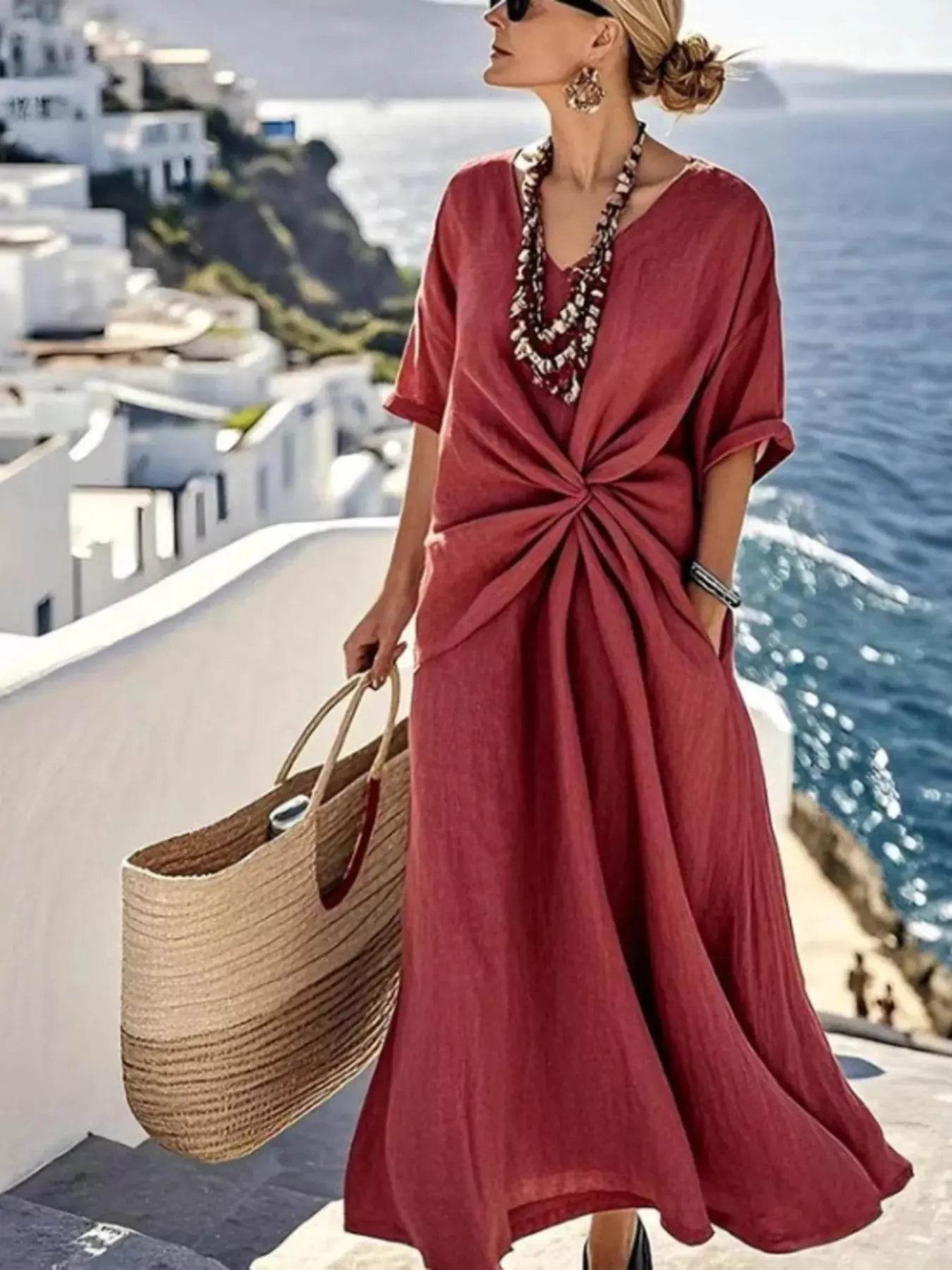 Twist front V-neck half sleeve maxi dress in a deep red color.