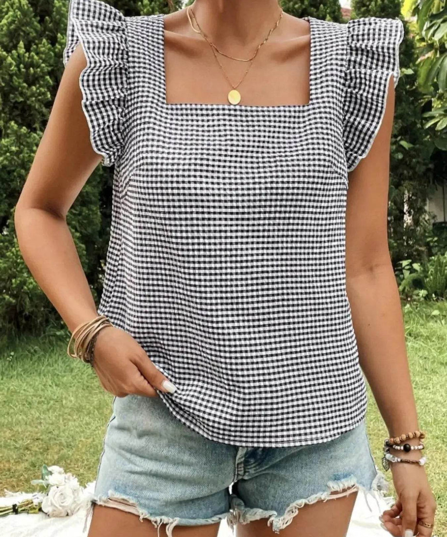 Gingham ruffle sleeve square neck blouse with light wash denim shorts.